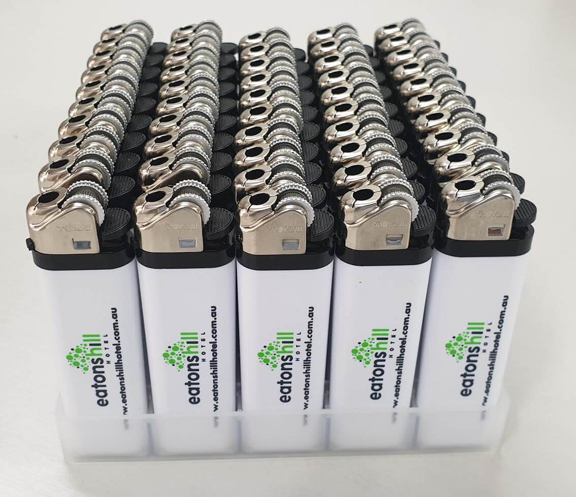 custom printed Tokai M13 flint lighters in retail tray display